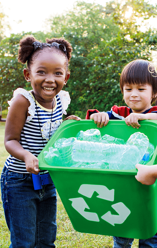 Children recycling smiling